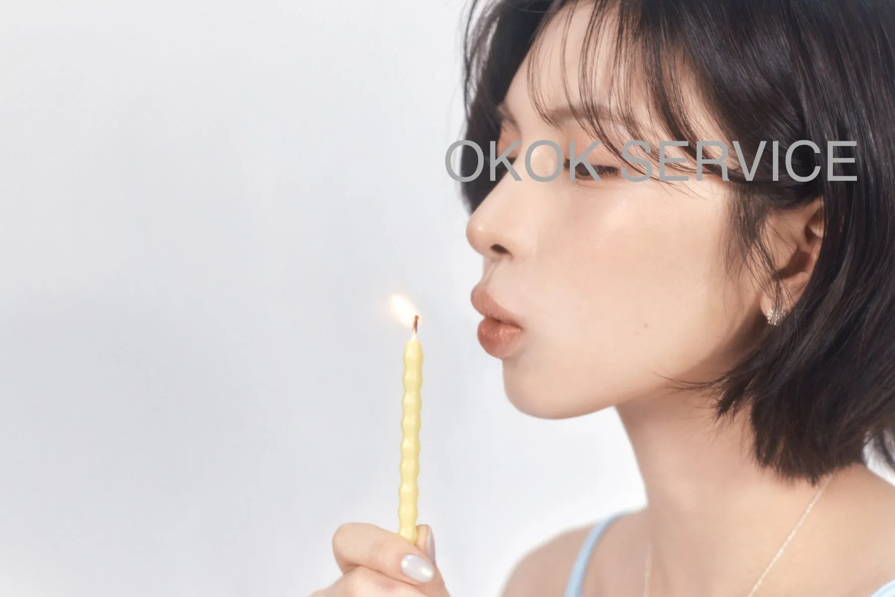 A planner blowing out a birthday candle